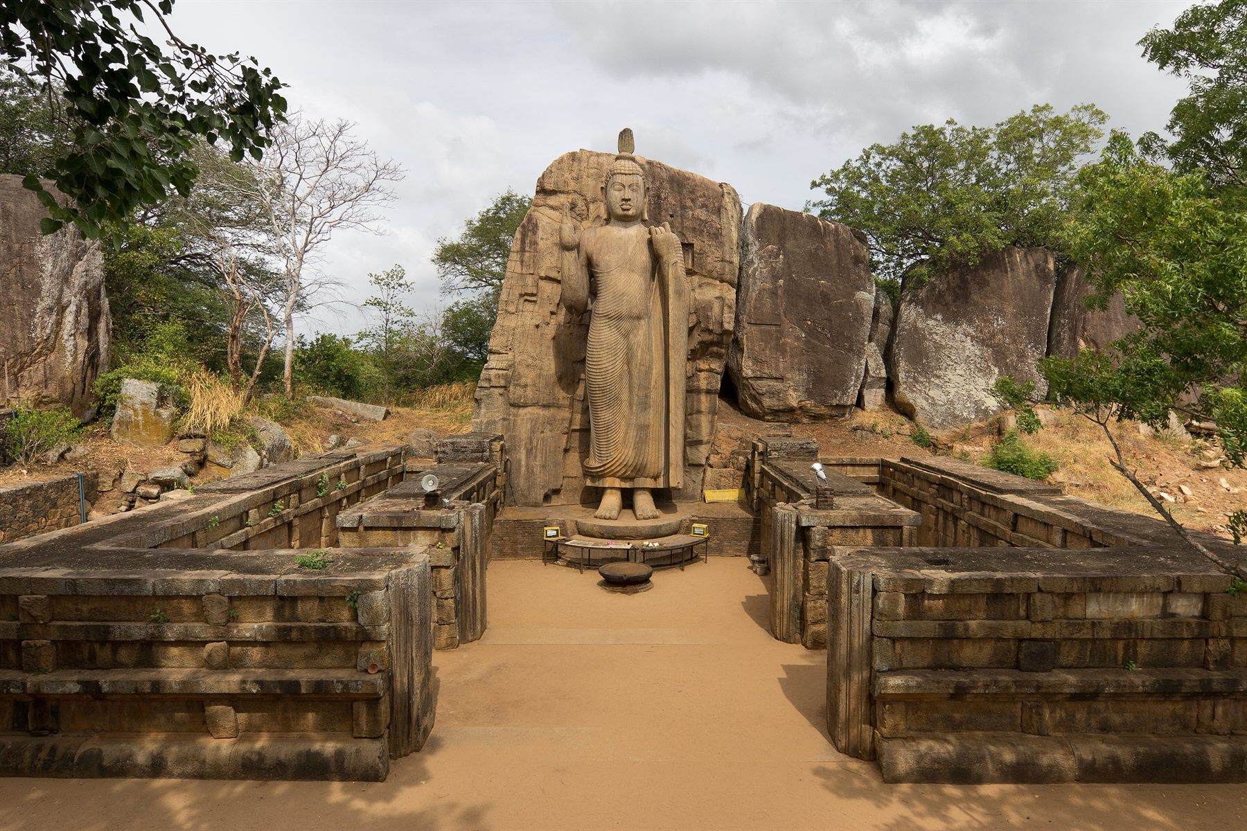 The Aukana Buddha, a twelve-metre standing figure carved from a single face of living rock.