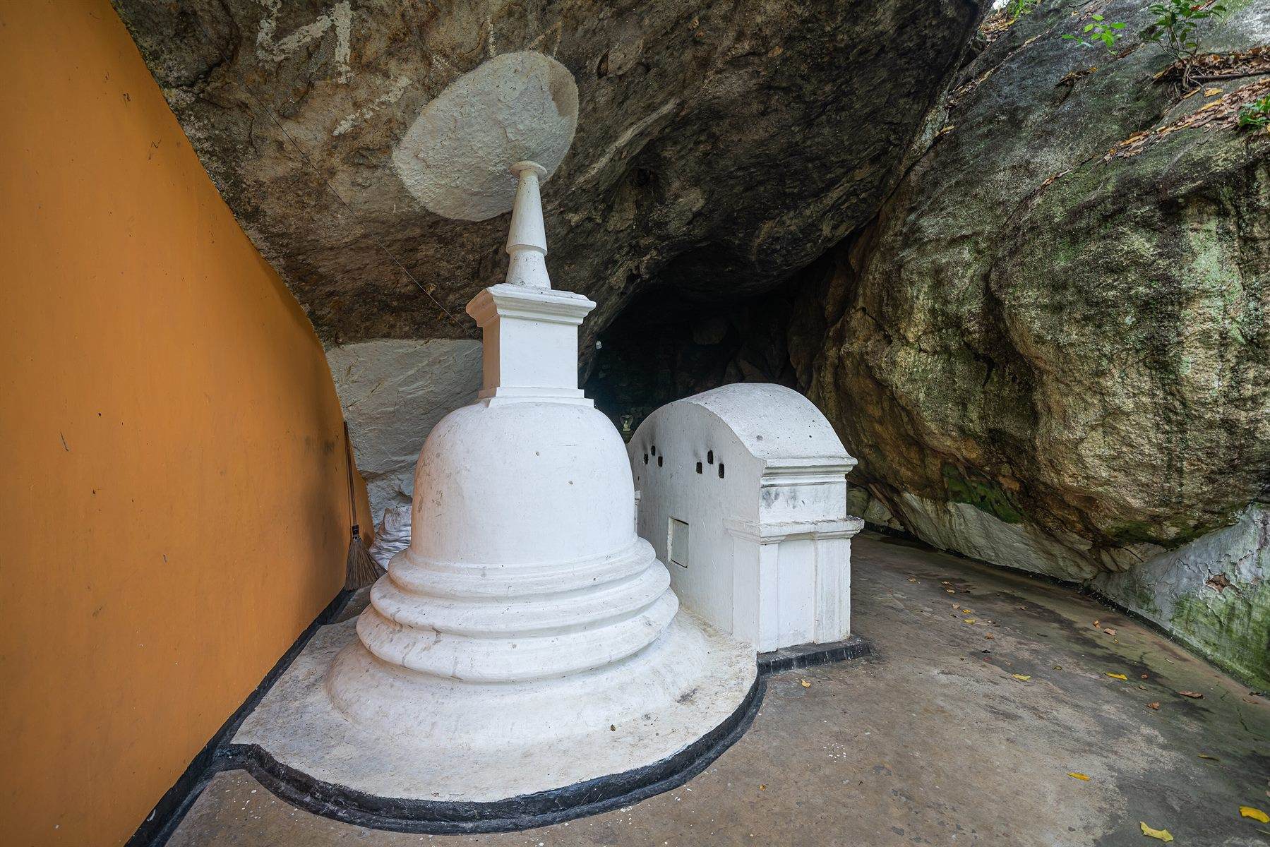 The rock-cut Buddha figure at the Dowa rock temple in the Sri Lankan hill country.