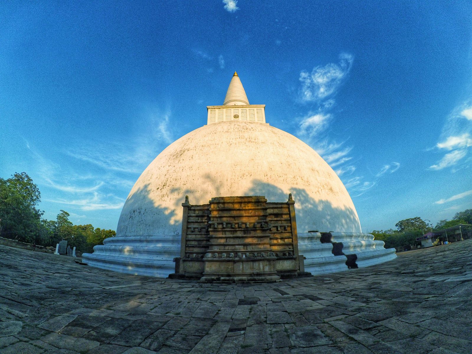 The Mirisawetiya stūpa at Anurādhapura, restored and white, on its square terrace.