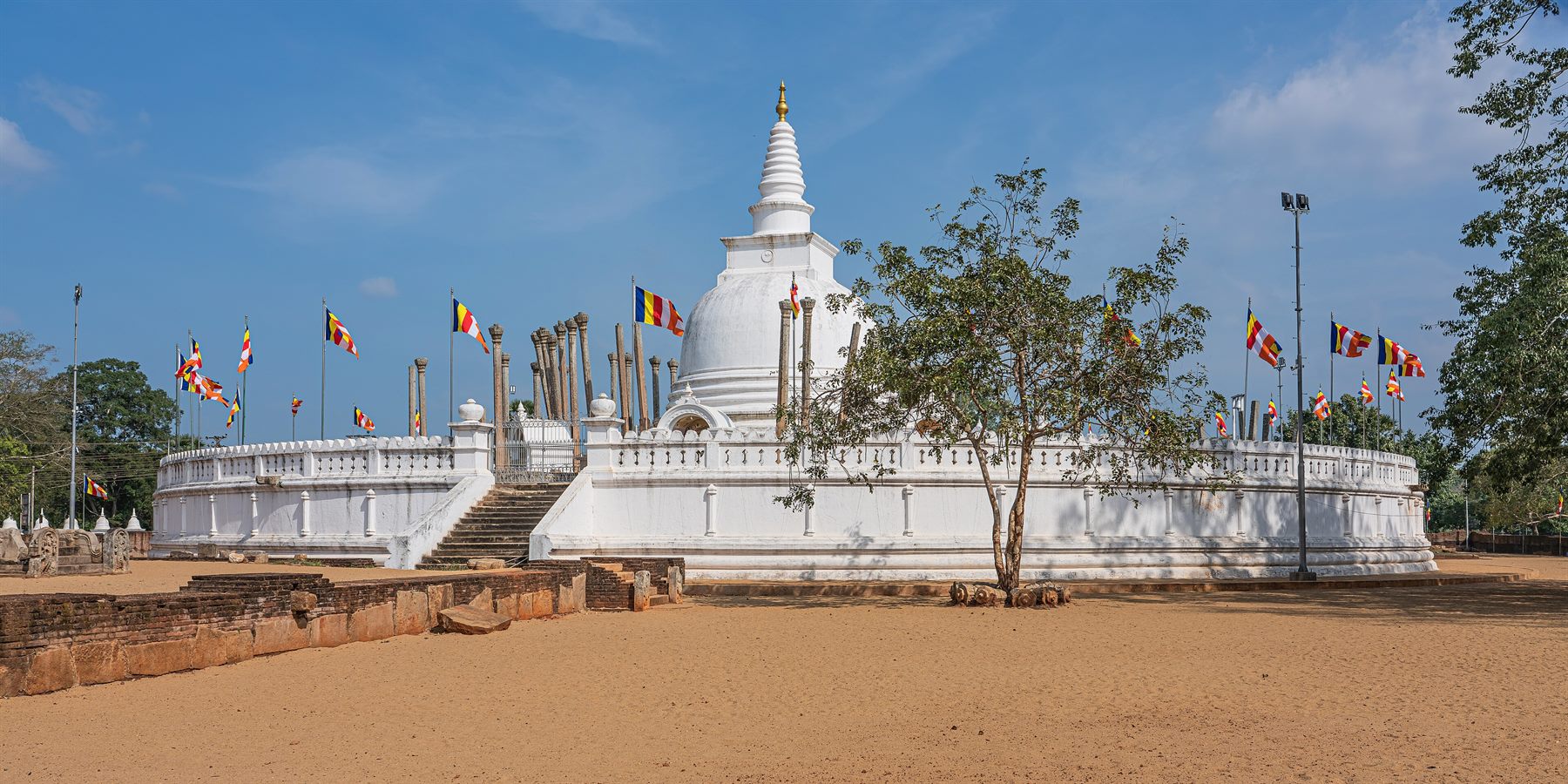Thūpārāmaya at Anurādhapura, the oldest stūpa in Sri Lanka, ringed by its surviving stone pillars.